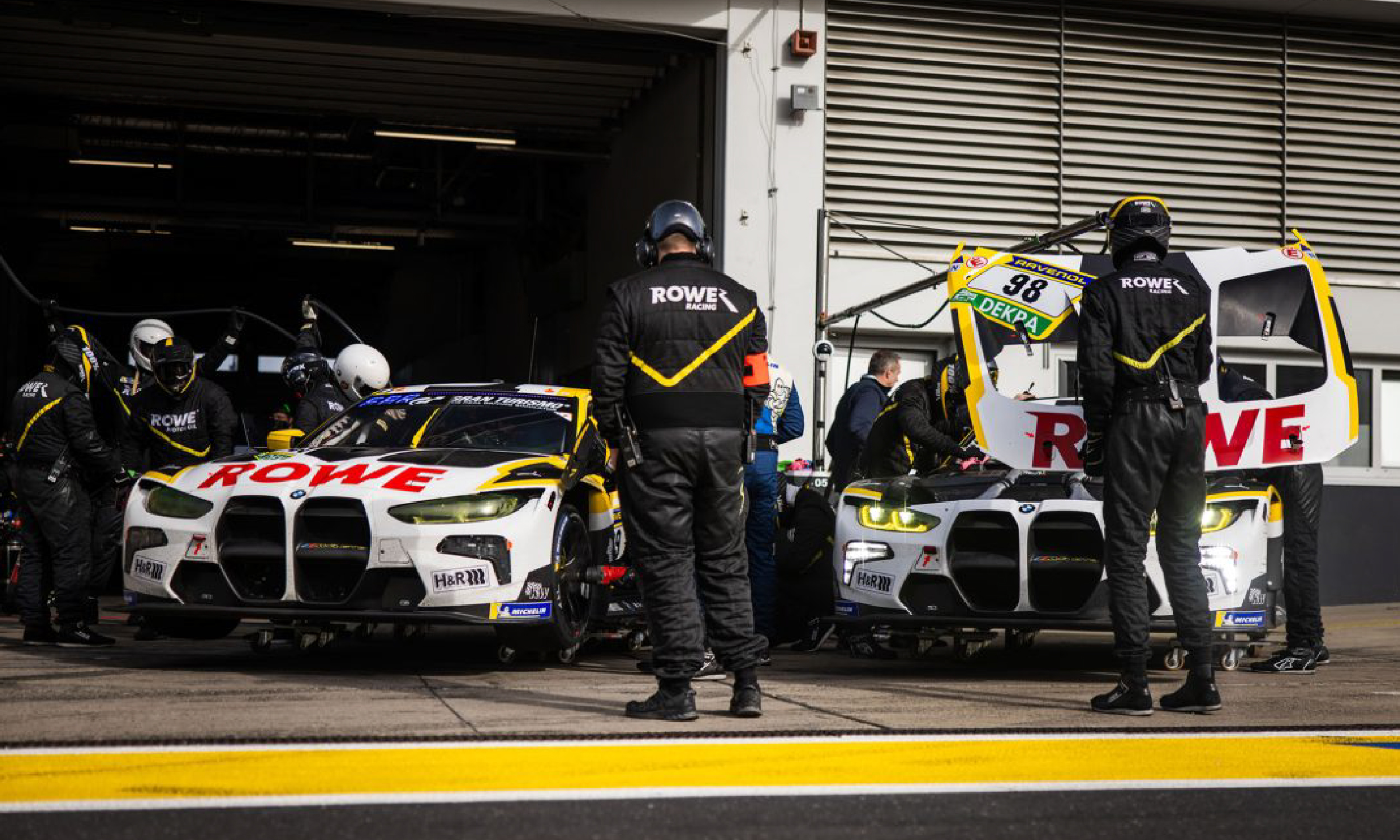 Technician inspecting underbody on lift